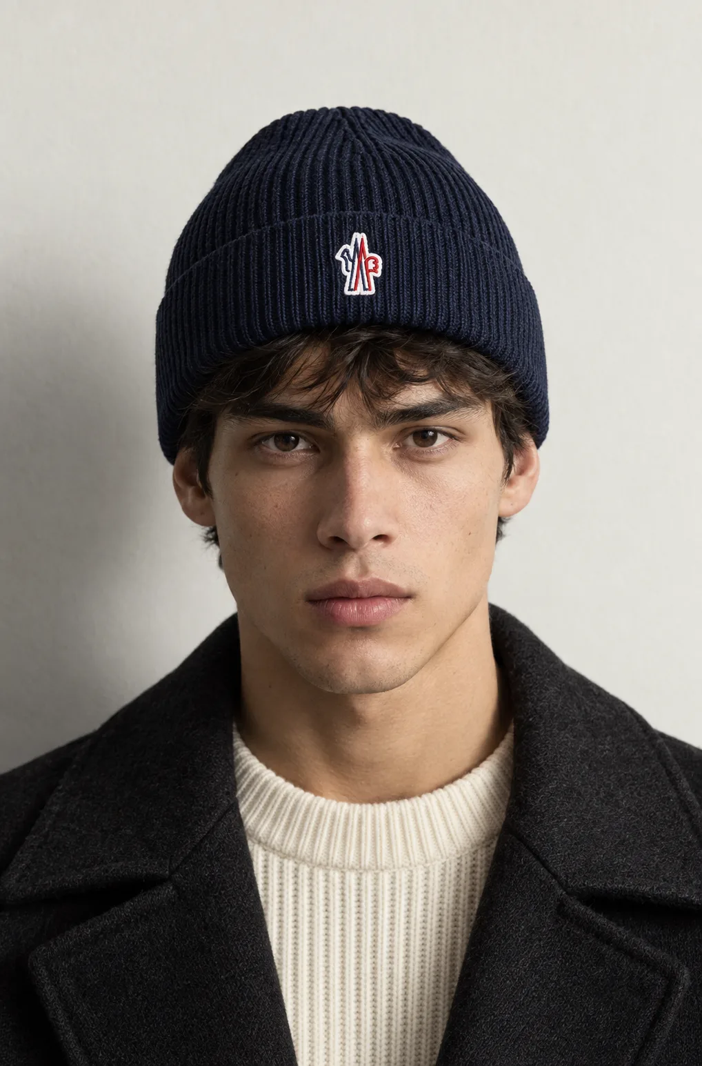 Ribbed Knit Beanie — Patch Logo — worn, front