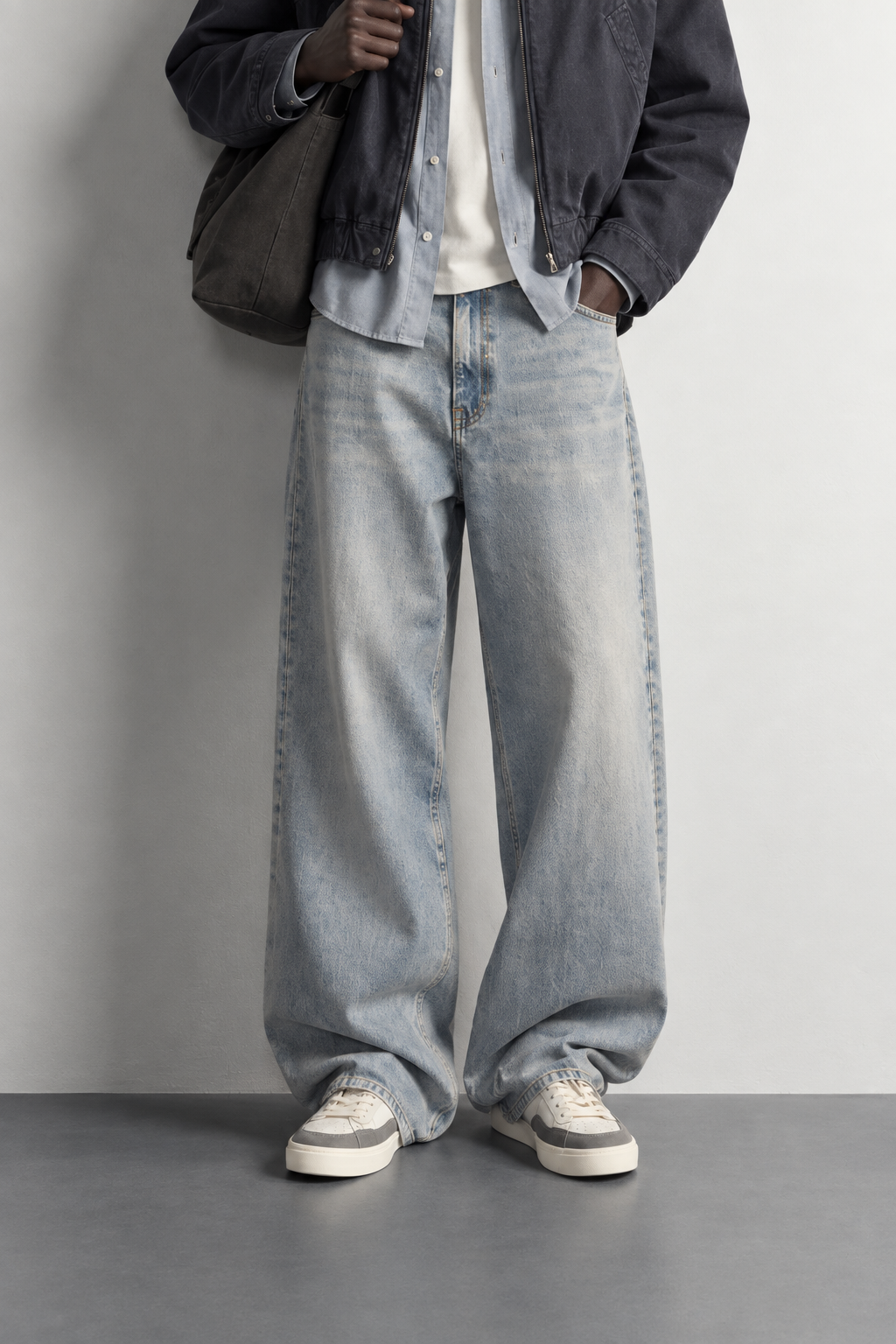 Faded Ice Blue Baggy Jeans — worn, close-up