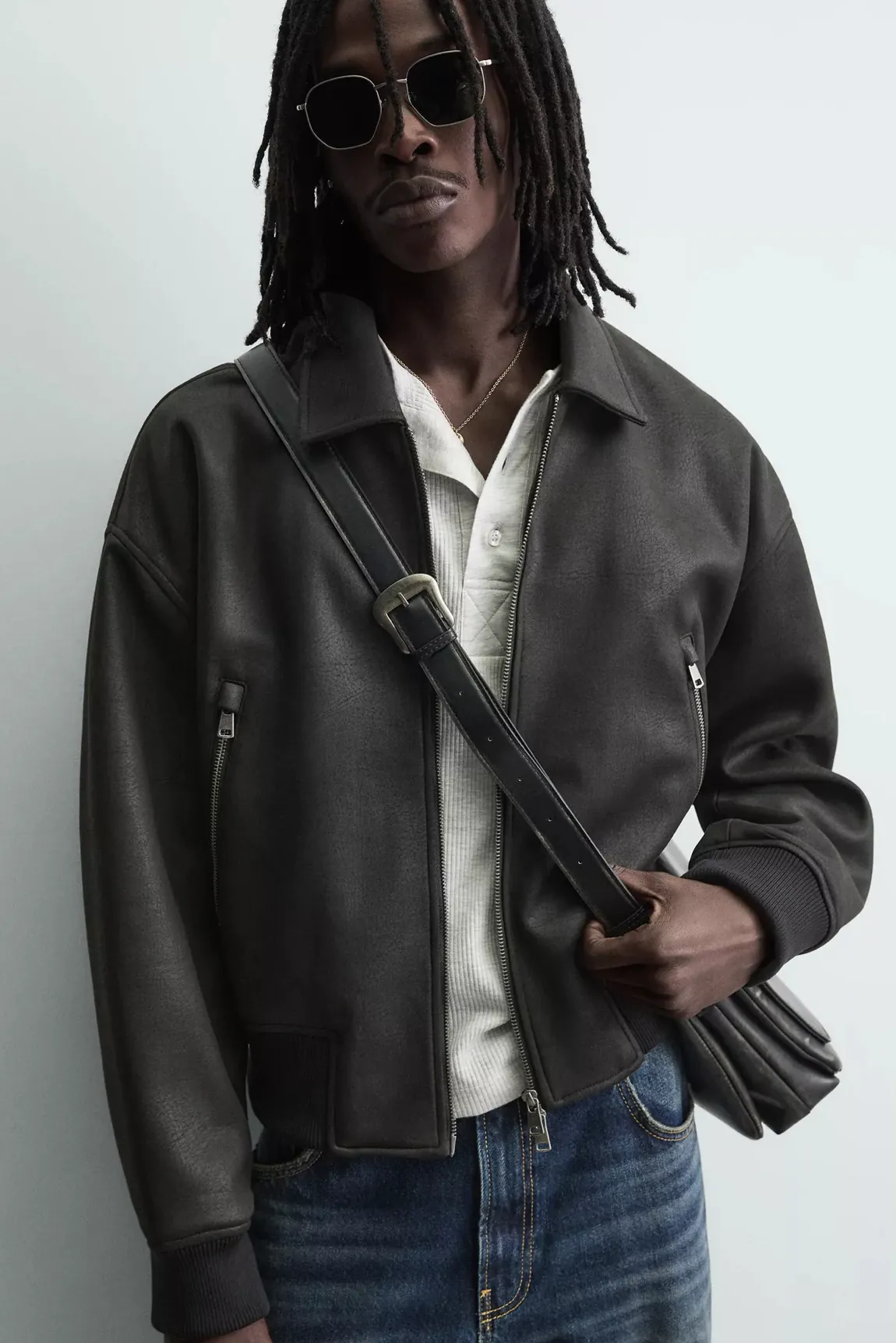 Leather Bomber Jacket with Ribbed Hem — worn, close-up