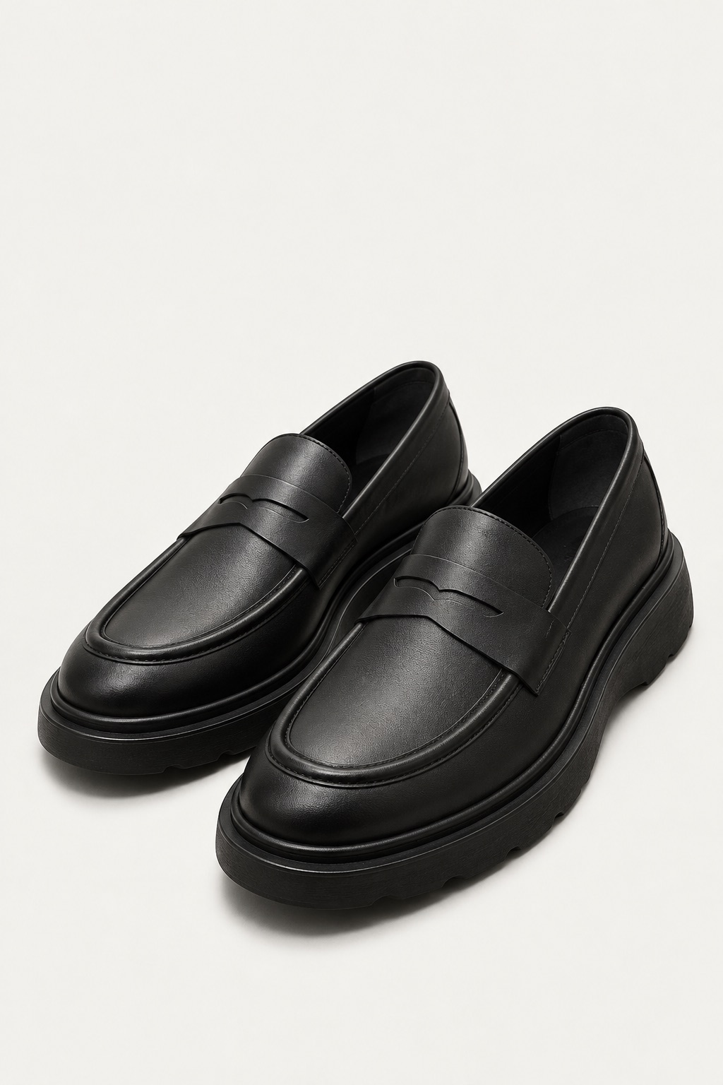 CHUNKY SOLE PENNY LOAFERS — worn, close-up